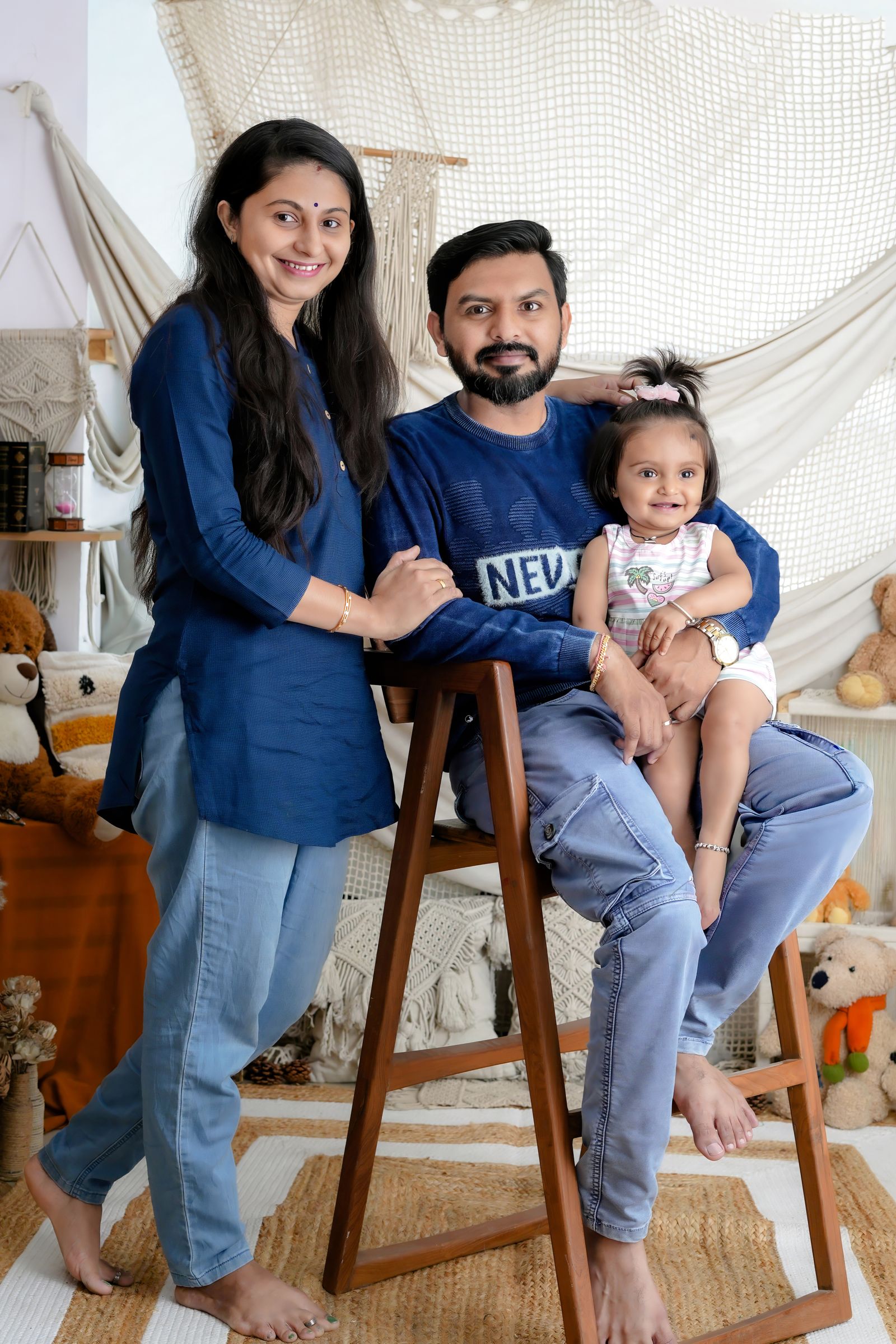 Happy Indian family in front of their new home